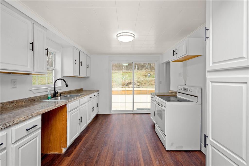 15 Maple Street Scenery Hill, PA 15360 - Photo 8 of 24 a kitchen with granite countertop a sink a counter space appliances and cabinets