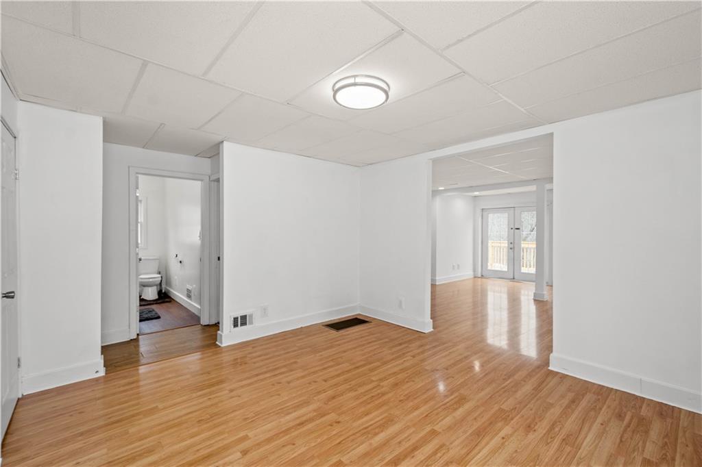 15 Maple Street Scenery Hill, PA 15360 - Photo 9 of 24 wooden floor in an empty room with a window