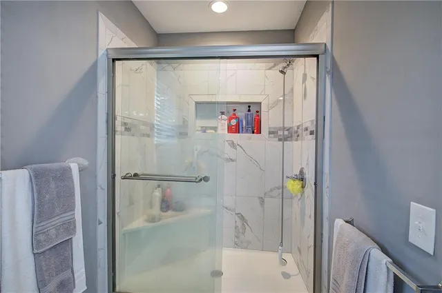 a bathroom with a shower and a tub