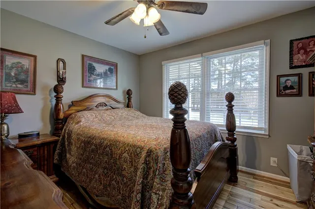 a bed room with a bed and a chandelier