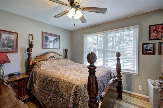 a bedroom with furniture and a window