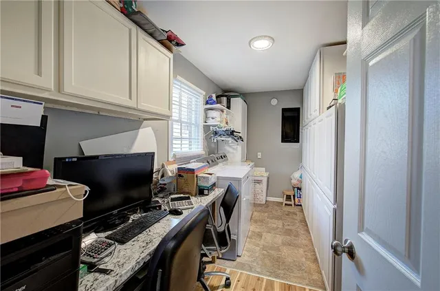 a workspace with furniture and a gate