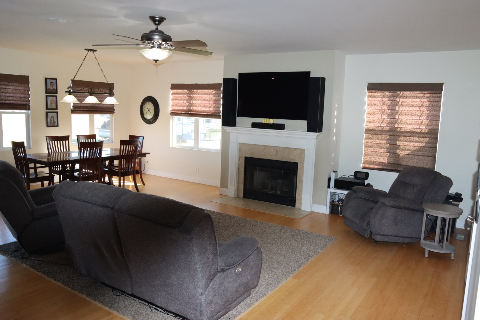 306 South 3rd Street Ashkum, IL 60911 - Photo 15 of 50 a living room with furniture a fireplace and a flat screen tv