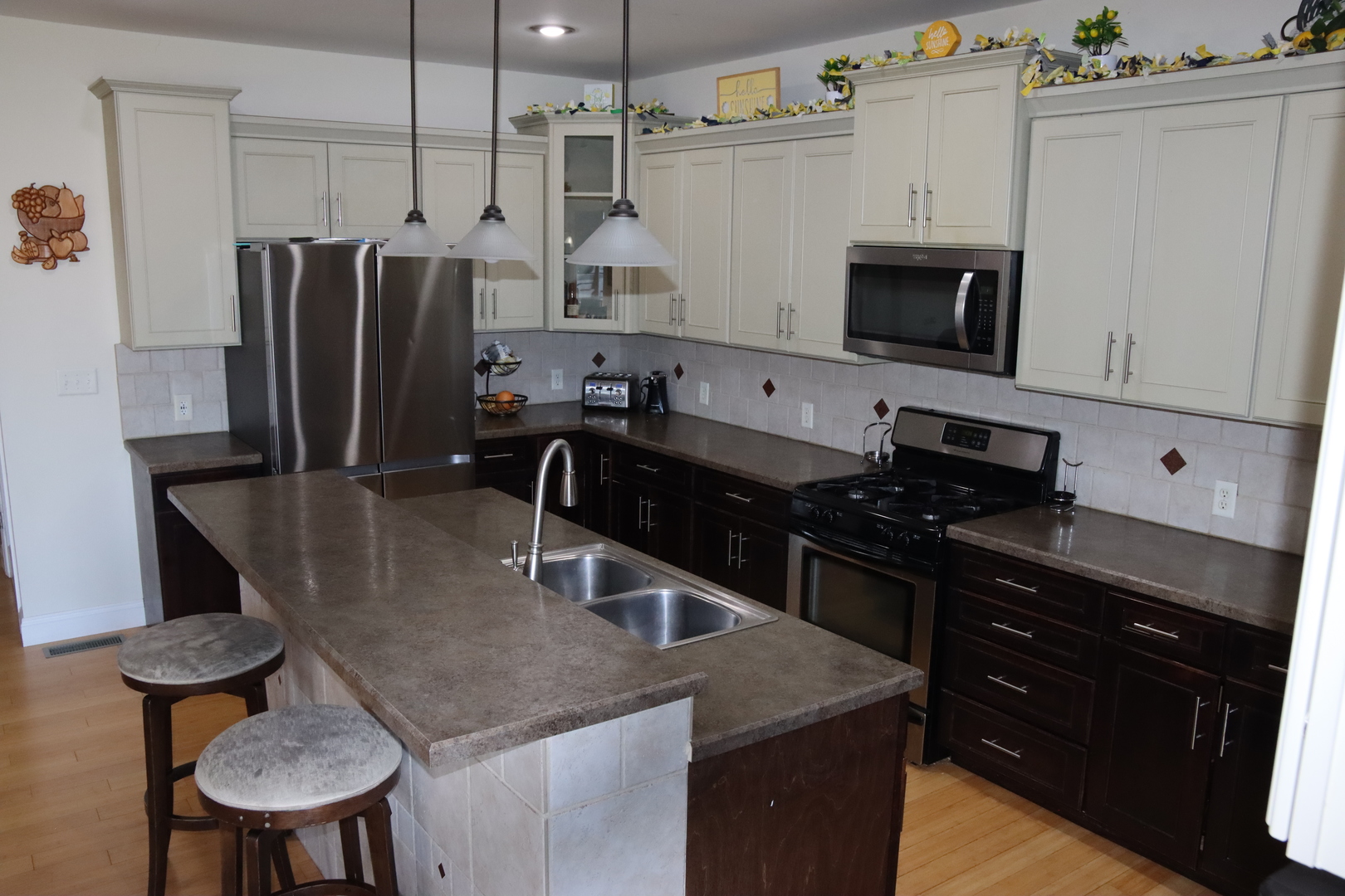 306 South 3rd Street Ashkum, IL 60911 - Photo 17 of 50 a kitchen with stainless steel appliances granite countertop a sink stove and refrigerator