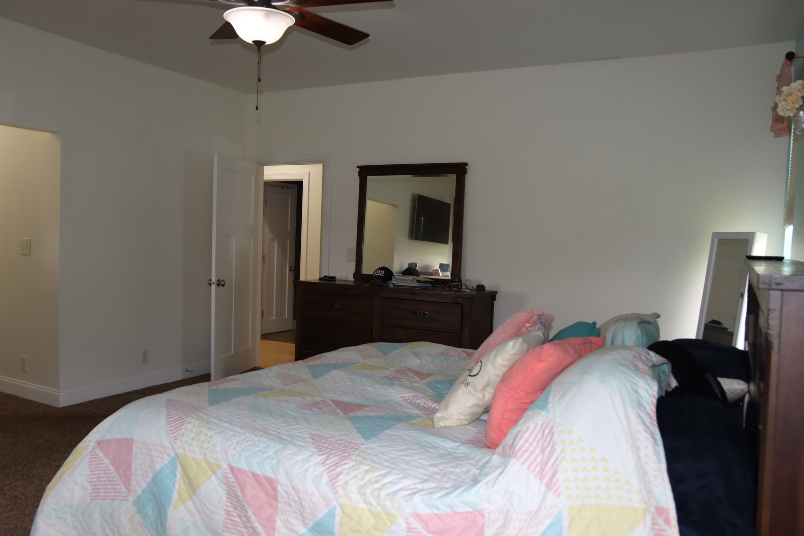 306 South 3rd Street Ashkum, IL 60911 - Photo 24 of 50 a bedroom with a bed and a chandelier