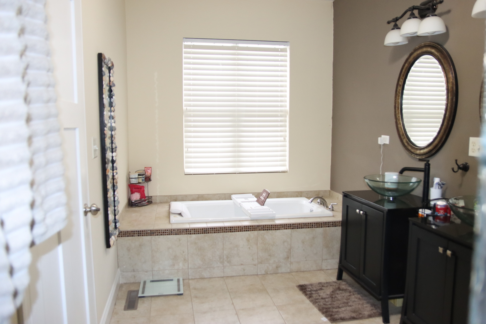 306 South 3rd Street Ashkum, IL 60911 - Photo 28 of 50 a bathroom with a granite countertop bathtub a sink and a mirror