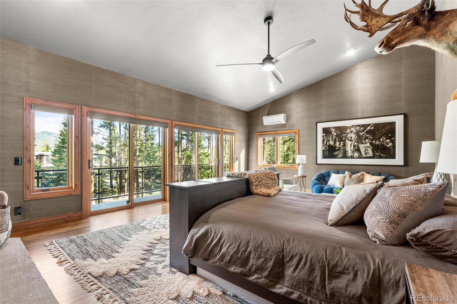 214 Wellington Road Breckenridge, CO 80424 - Photo 20 of 48 a bedroom with a large bed and a large window