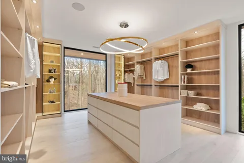 a kitchen with stainless steel appliances granite countertop a sink a stove and a microwave