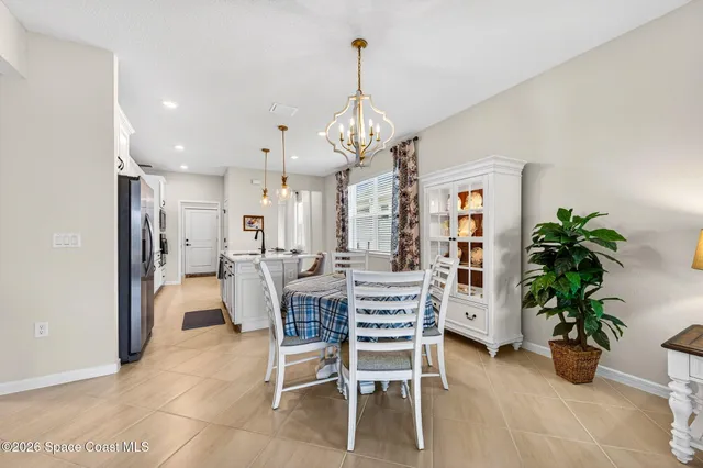 a living room with furniture a lamp and a flat screen tv