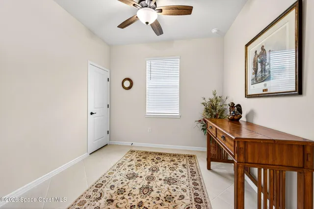 a view of a house with backyard and porch