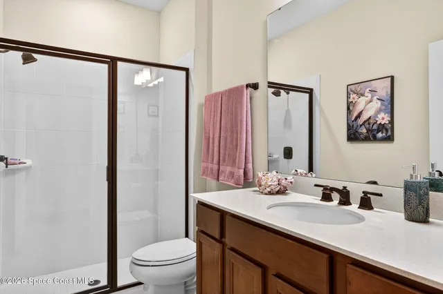 a view of a house with backyard and porch