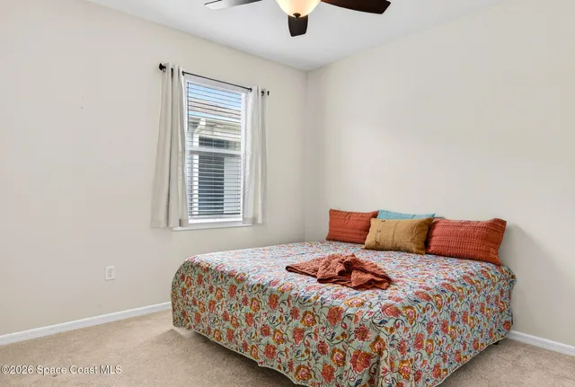 a view of a lake with houses in the background