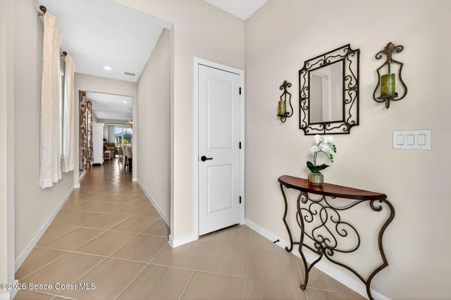 a kitchen with stainless steel appliances kitchen island granite countertop a sink a stove a dining table and chairs