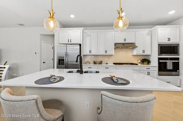 a view of a livingroom with furniture window and wooden floor
