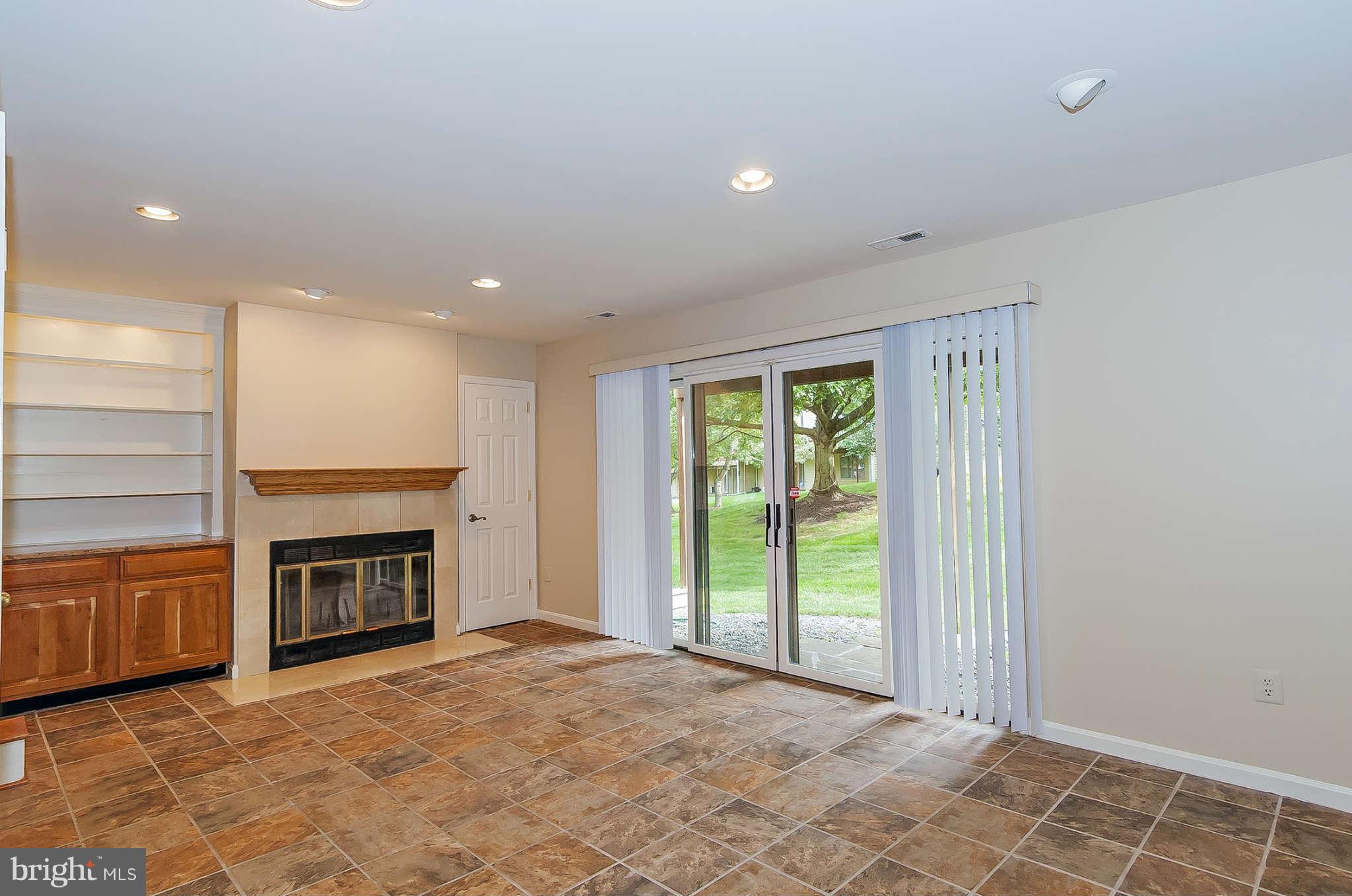 5077 Columbia Road Columbia, MD 21044 - Photo 9 of 11 Family Room with fireplace and double walk out