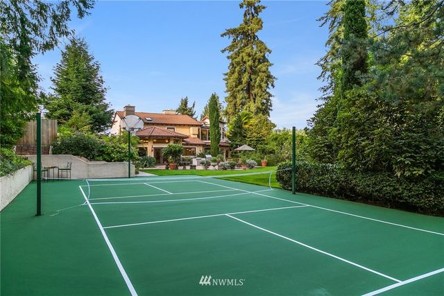 a living room with fireplace furniture and a chandelier