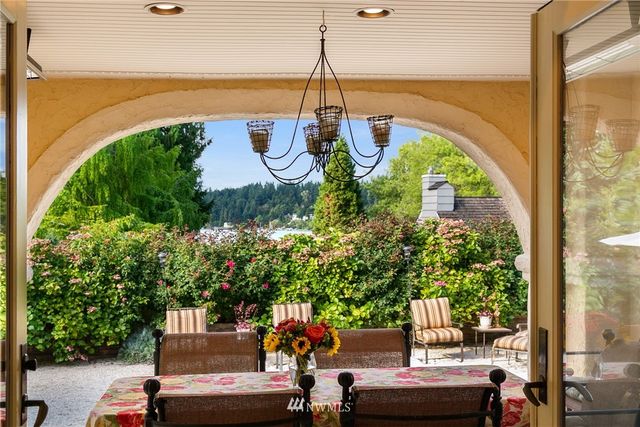 a dining room with furniture a rug and wooden floor