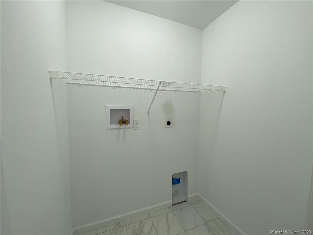 47 Rowland Farm Road, Unit 28 Oxford, CT 06478 - Photo 12 of 16 a view of a room with racks on the wall