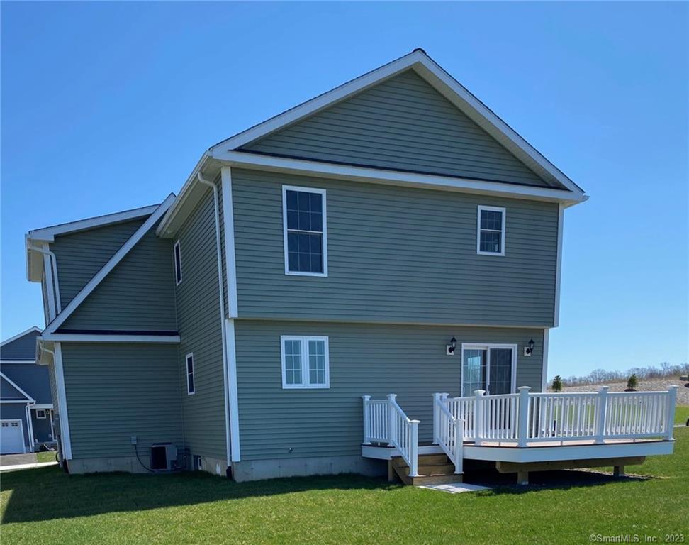 47 Rowland Farm Road, Unit 28 Oxford, CT 06478 - Photo 14 of 16 a view of house with backyard and outdoor seating