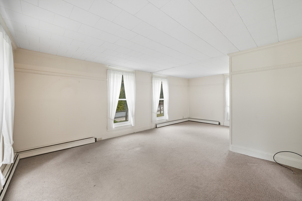 254 Route 20 Chester, MA 01011 - Photo 11 of 38 an empty room with windows
