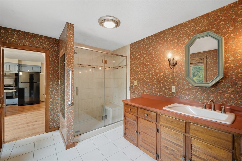 254 Route 20 Chester, MA 01011 - Photo 14 of 38 a bathroom with a double vanity sink mirror and shower