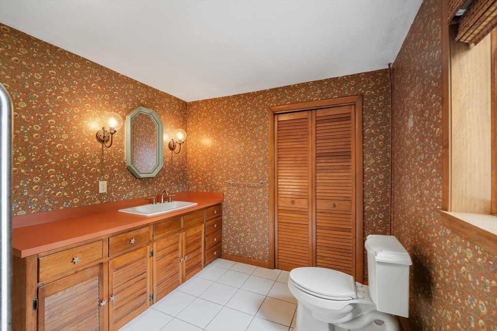 254 Route 20 Chester, MA 01011 - Photo 15 of 38 a spacious bathroom with a double vanity sink toilet mirror and shower