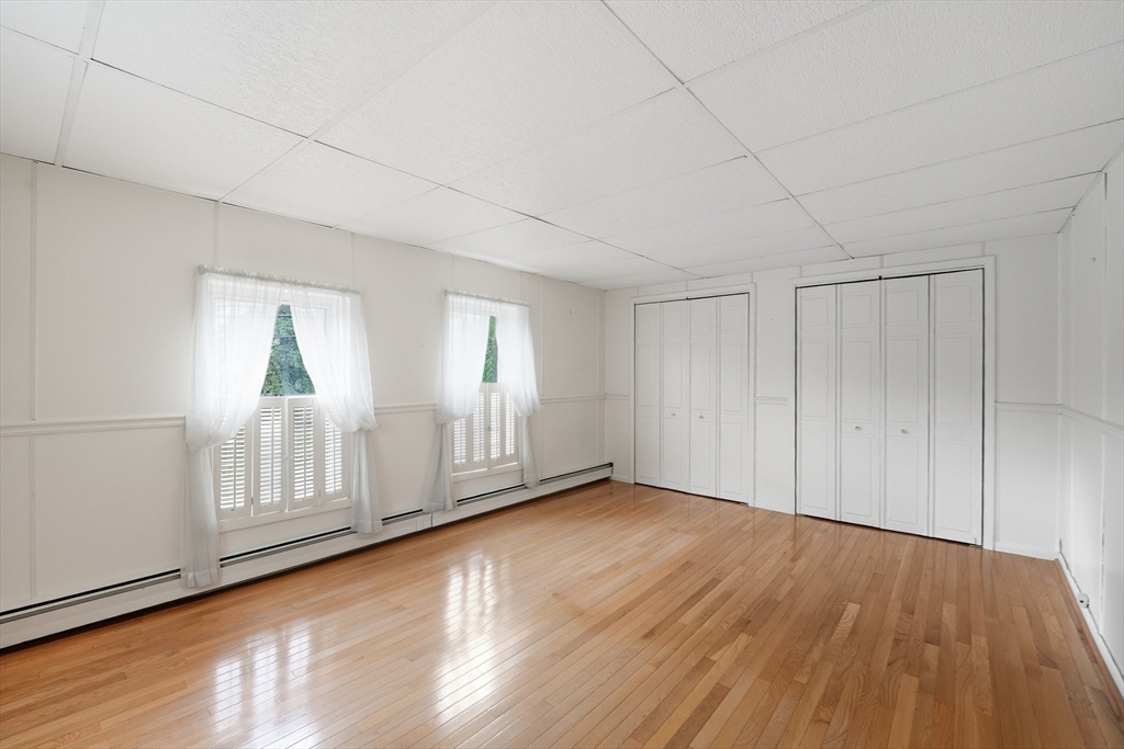 254 Route 20 Chester, MA 01011 - Photo 16 of 38 a view of empty room with wooden floor and fan