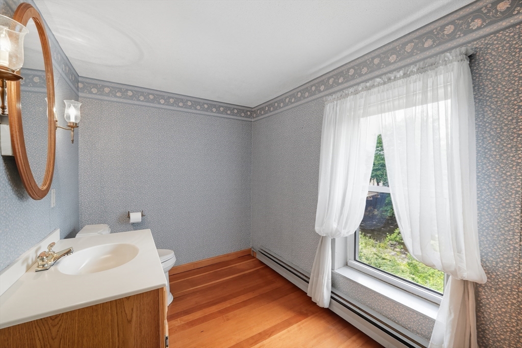 254 Route 20 Chester, MA 01011 - Photo 19 of 38 a bathroom with a sink and a mirror