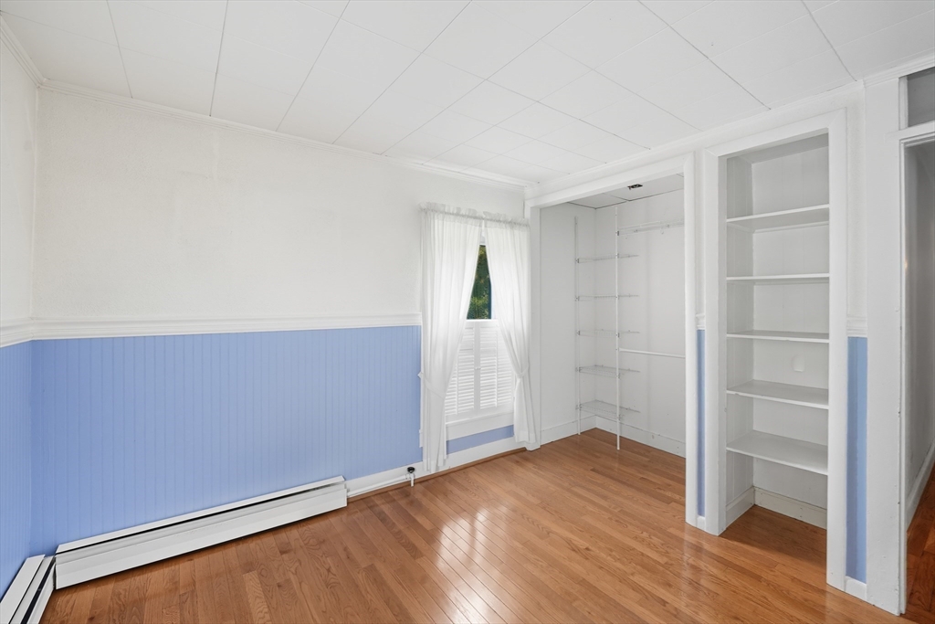 254 Route 20 Chester, MA 01011 - Photo 24 of 38 an empty room with wooden floor