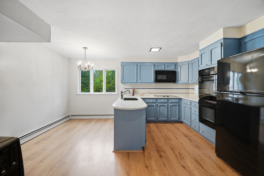 254 Route 20 Chester, MA 01011 - Photo 3 of 38 a kitchen with a refrigerator and a stove