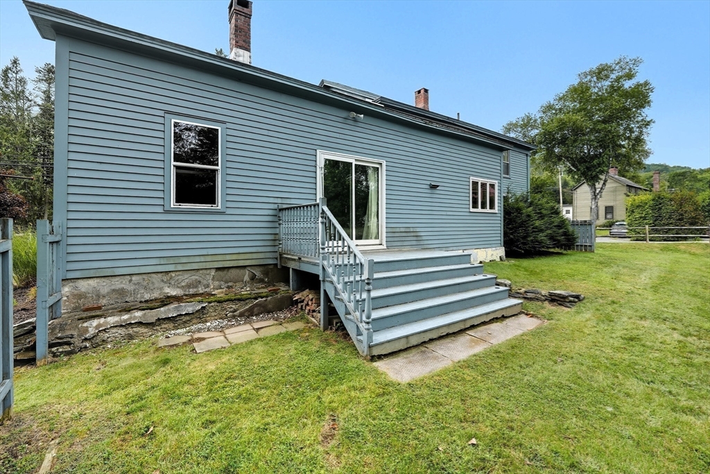 254 Route 20 Chester, MA 01011 - Photo 32 of 38 a front view of a house with a yard