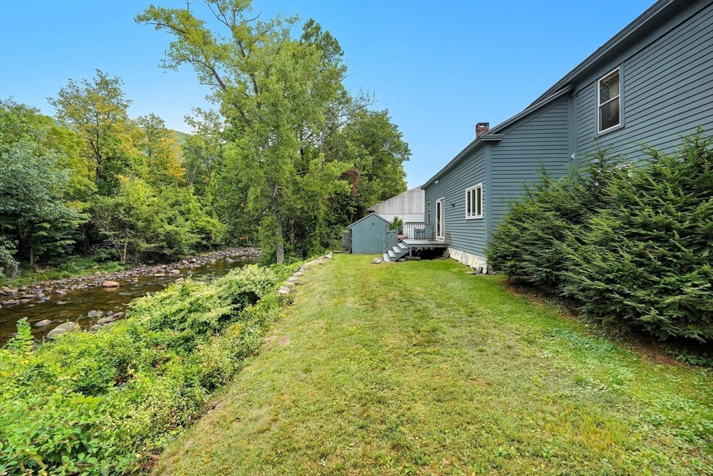254 Route 20 Chester, MA 01011 - Photo 33 of 38 a view of a house with a yard