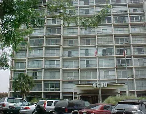 a front view of a building with parking space