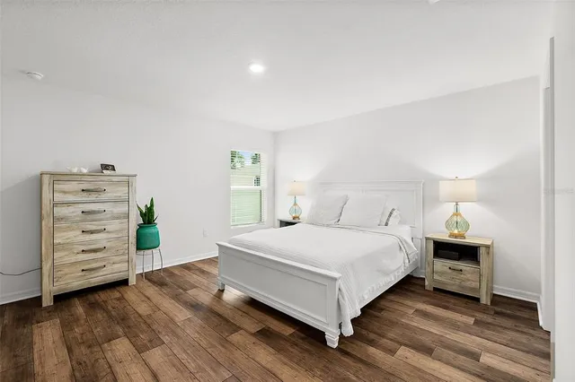 a bedroom with a bed and a dresser