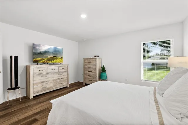 a bedroom with a bed and furniture