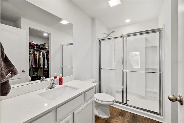 a bathroom with a sink toilet and shower