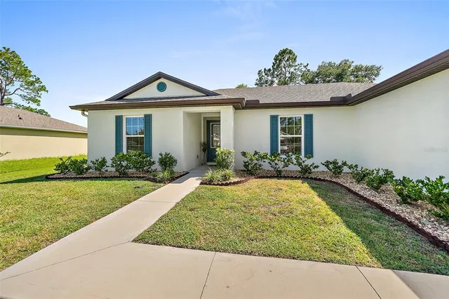 a view of a house with garden