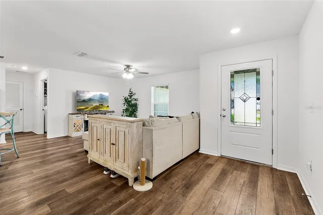 a view of a livingroom with wooden floor