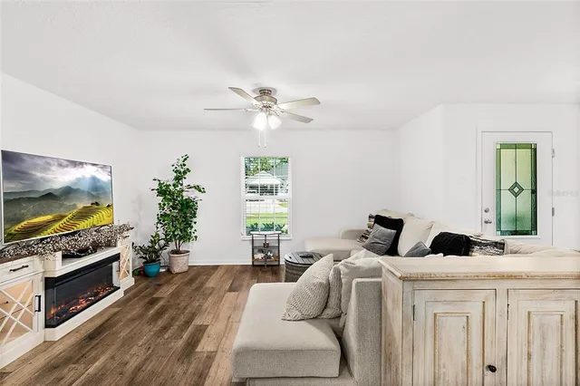 a bedroom with furniture and a flat screen tv