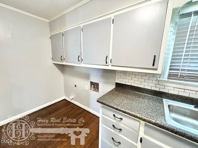 a kitchen with a sink and cabinets