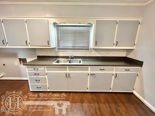 a close view of sink and cabinets