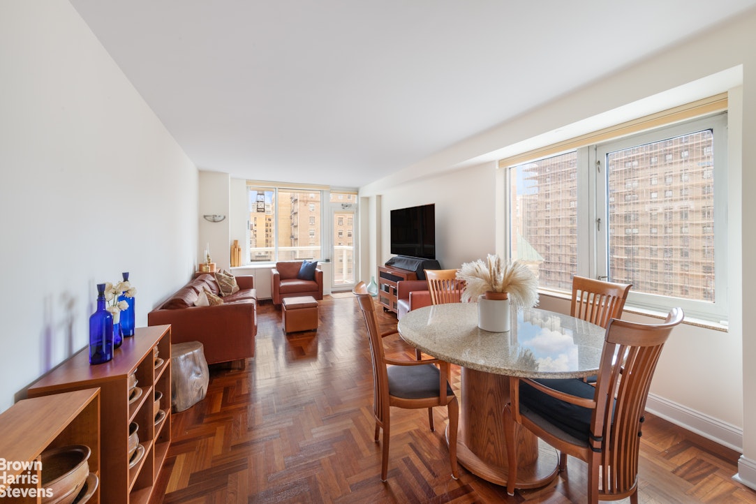a view of a dining room with furniture window and outside view