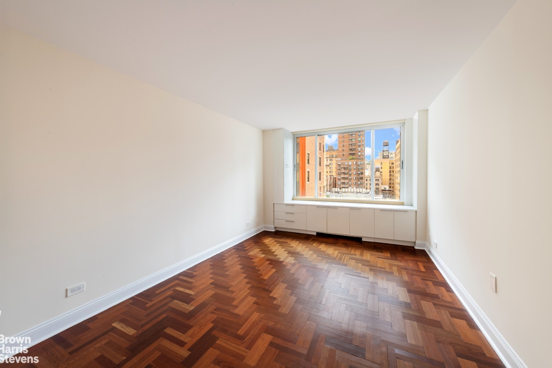 2373 Broadway, Unit 930 Manhattan, NY 10024 - Photo 4 of 12 an empty room with windows