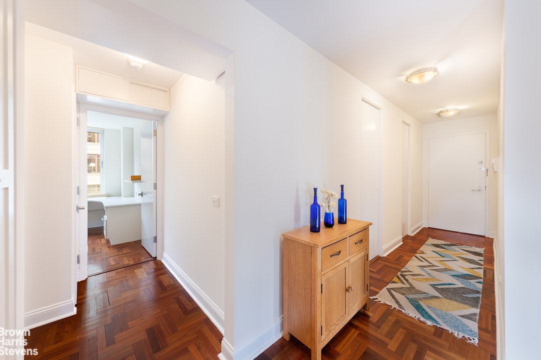 2373 Broadway, Unit 930 Manhattan, NY 10024 - Photo 6 of 12 a room with furniture and a wooden floor