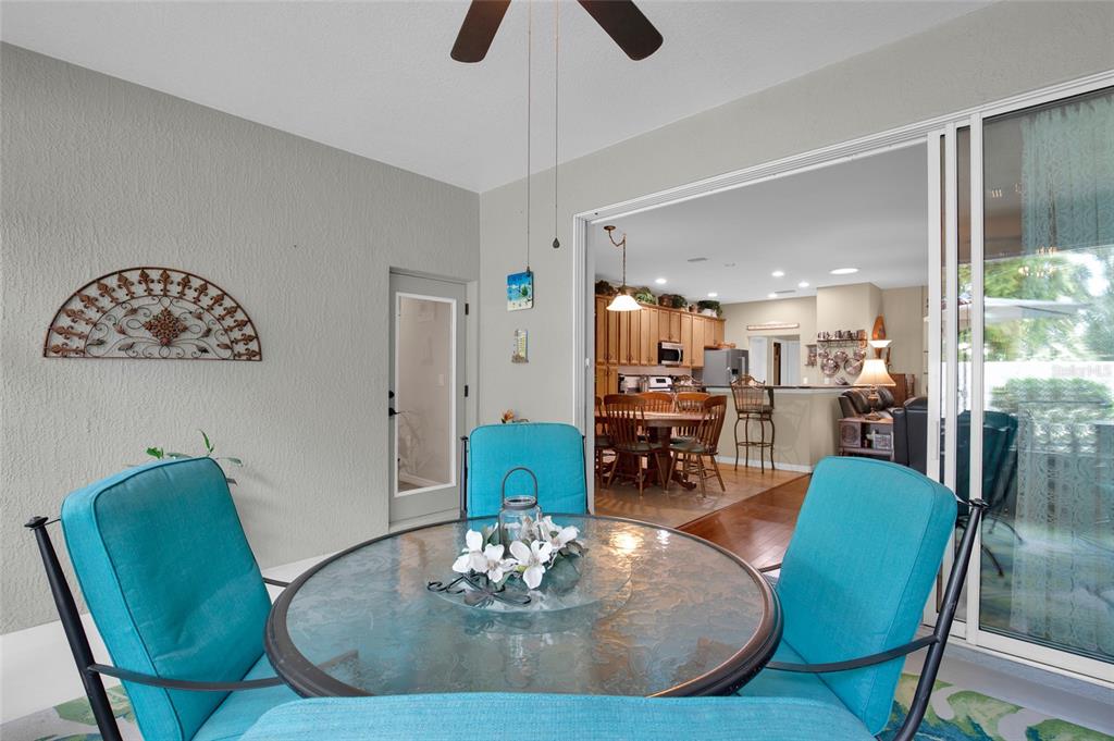 16411 Southwest 14th Avenue Road Ocala, FL 34473 - Photo 35 of 59 a view of a dining room with furniture and wooden floor