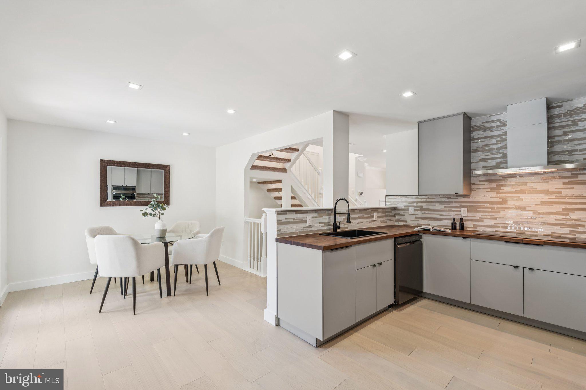 43501 Postrail Square Ashburn, VA 20147 - Photo 13 of 35 a large kitchen with lots of white cabinets