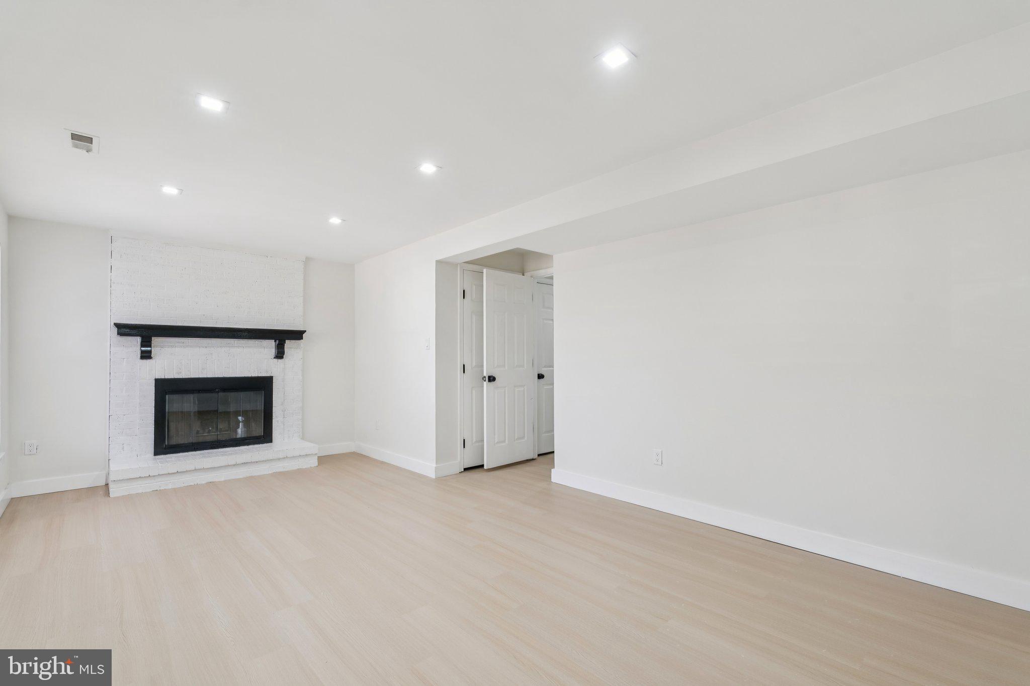 43501 Postrail Square Ashburn, VA 20147 - Photo 30 of 35 a view of an empty room with a fireplace