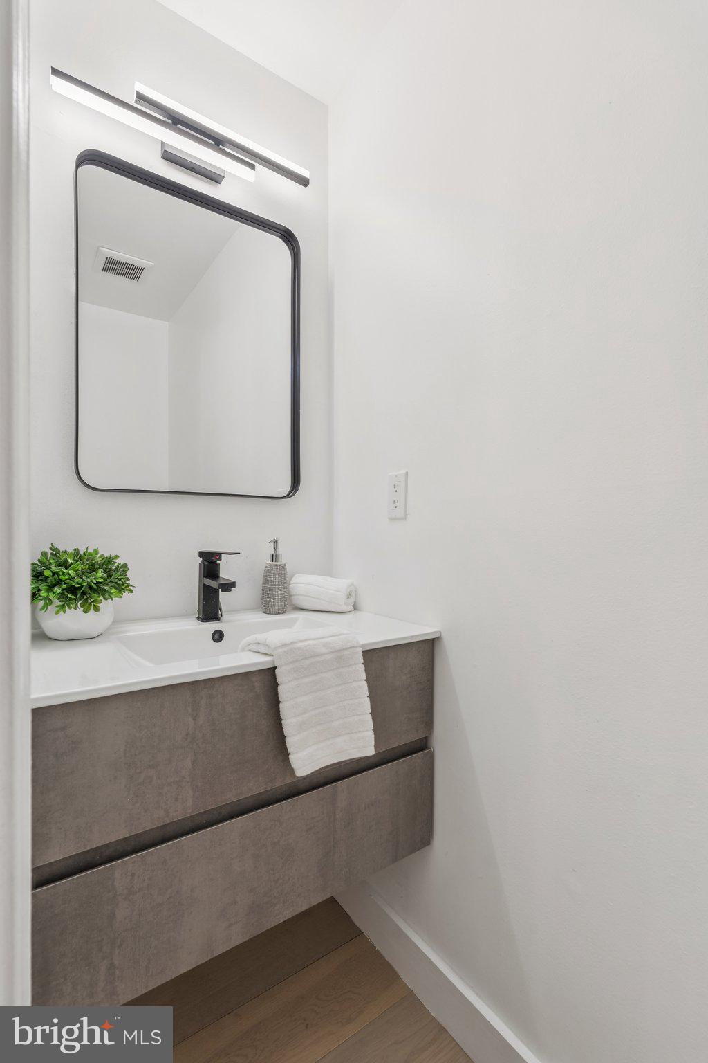 43501 Postrail Square Ashburn, VA 20147 - Photo 7 of 35 a bathroom with a sink and a mirror