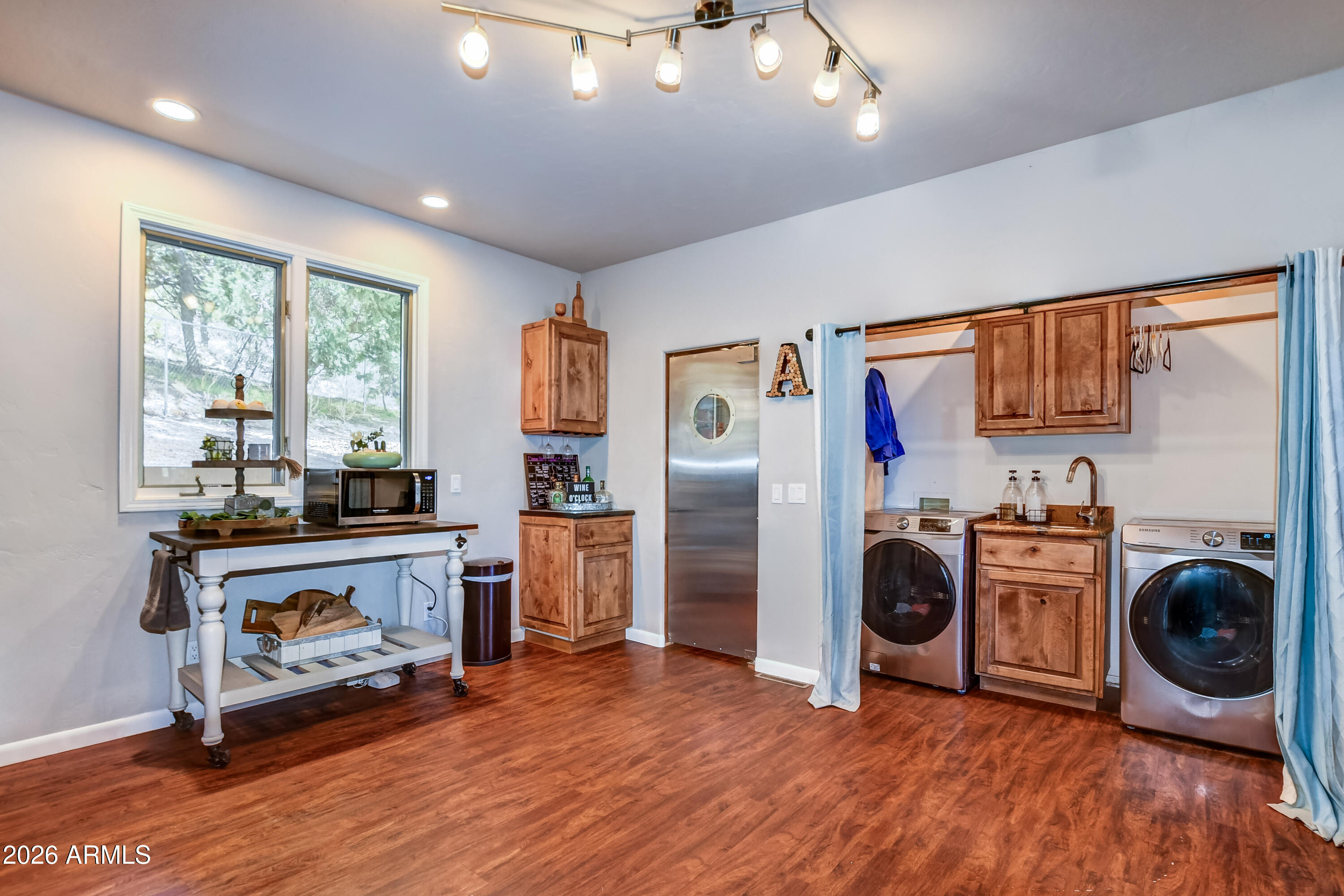 3000 Shadow Valley Ranch Road Prescott, AZ 86305 - Photo 29 of 70 a view of a kitchen with fridge and wooden floor