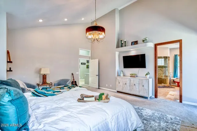 a view of empty room with wooden floor and ceiling fan
